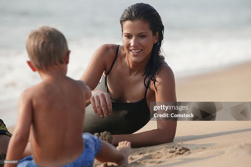 Mother and son playing on beach