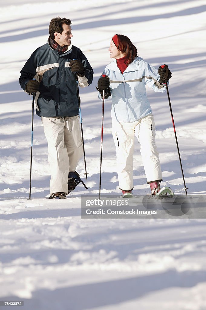 Couple snowshoeing