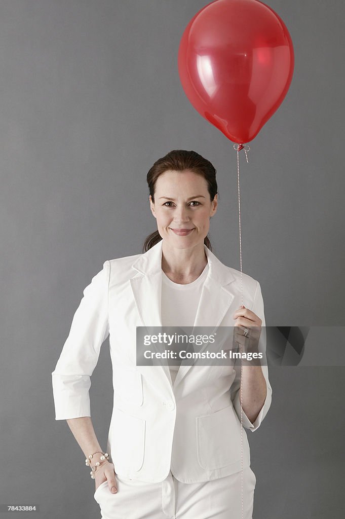 Businesswoman with balloon