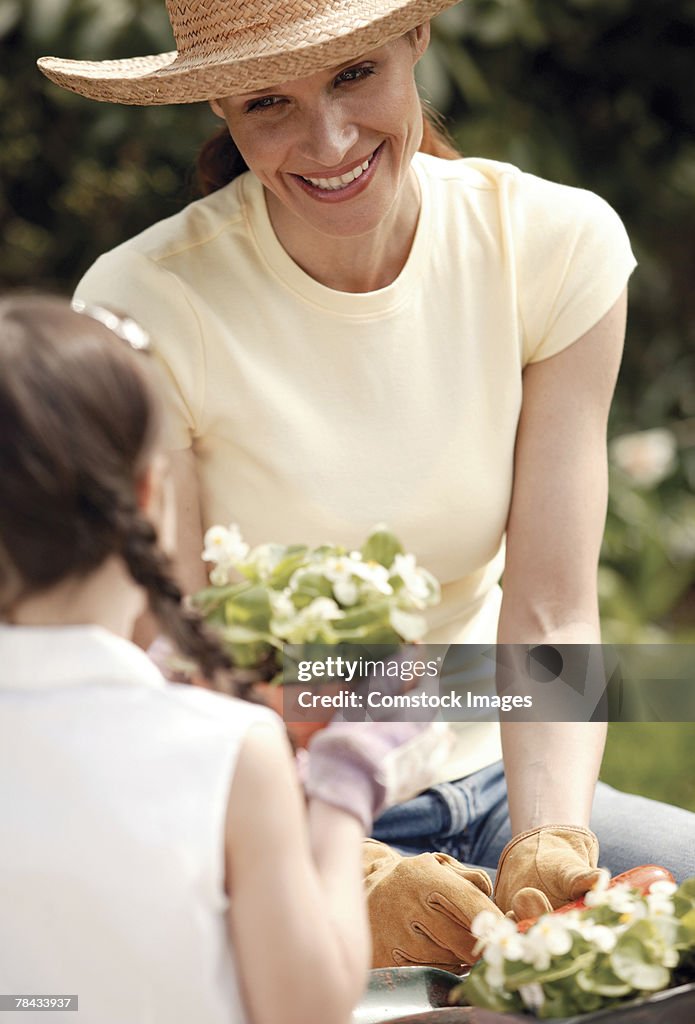 Mother gardening with daughter