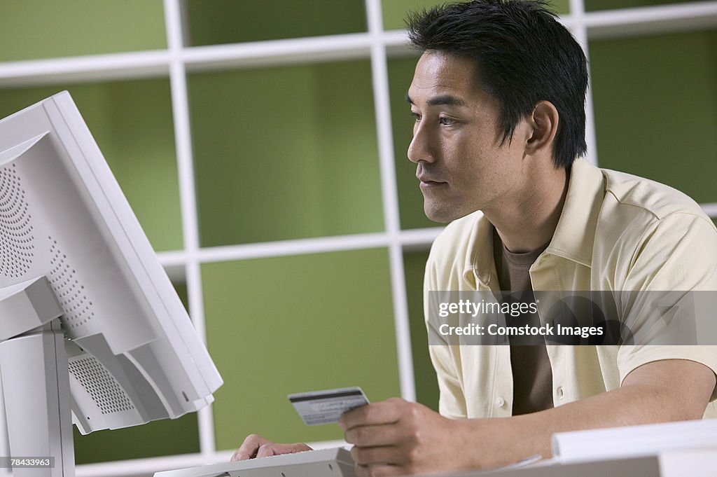 Man ordering online with credit card