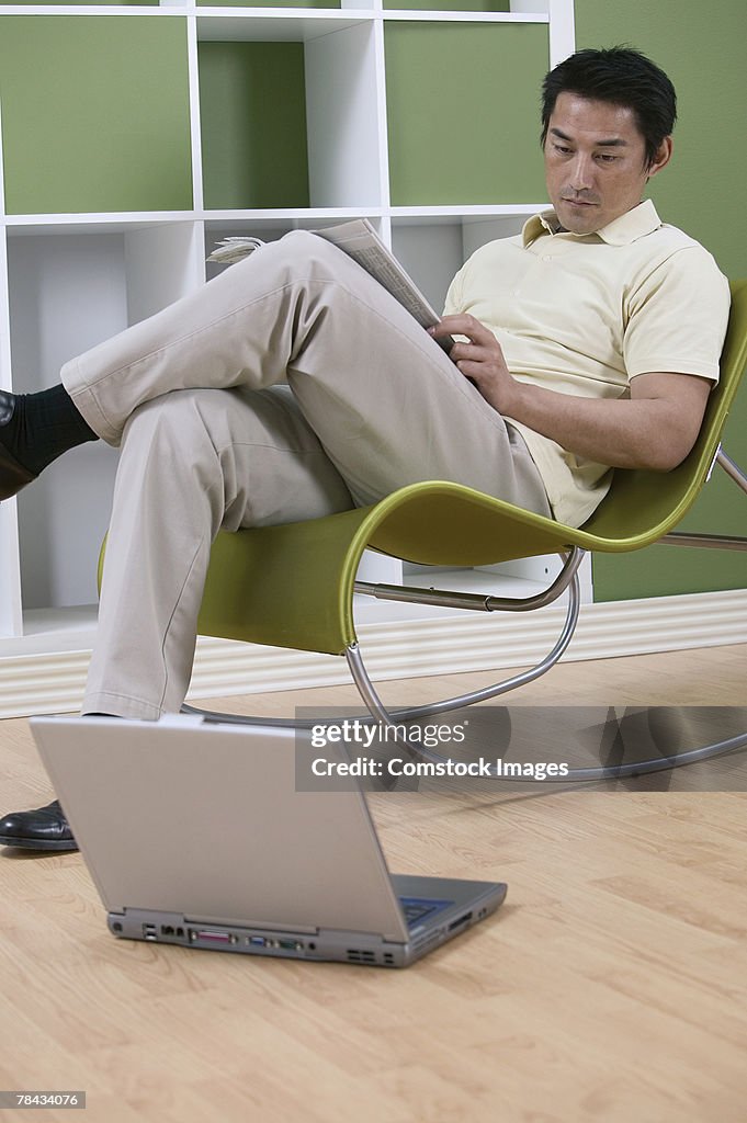 Man sitting by laptop