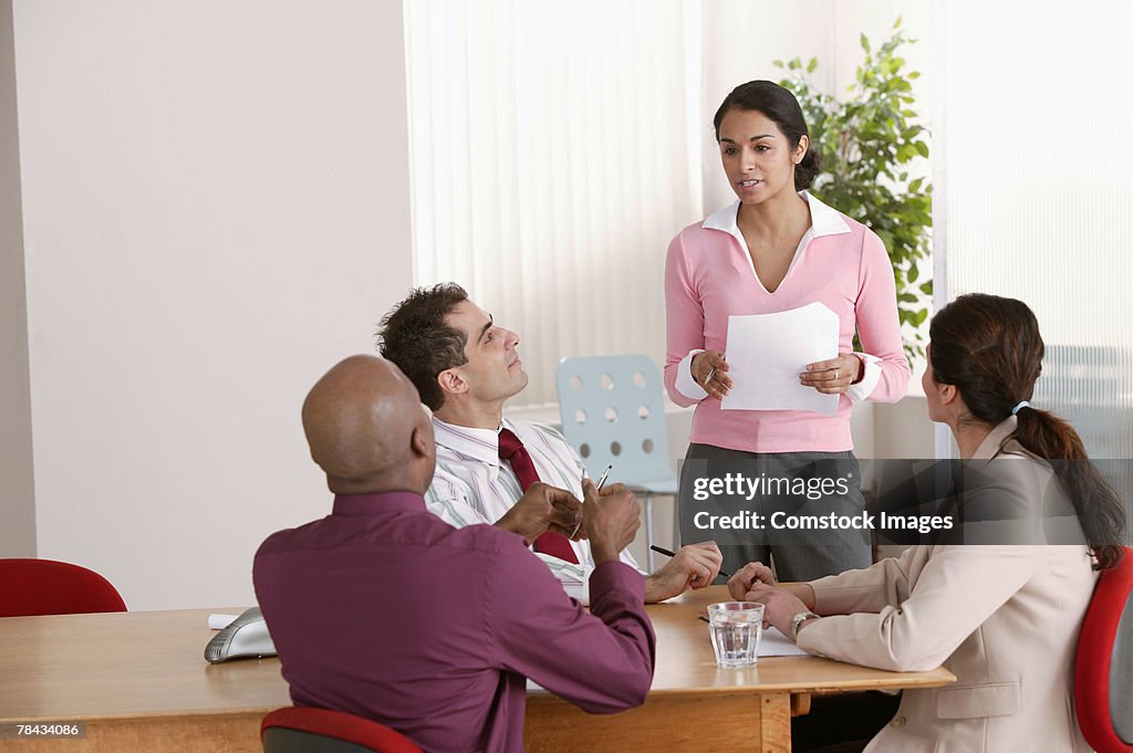 Businesspeople talking in office meeting