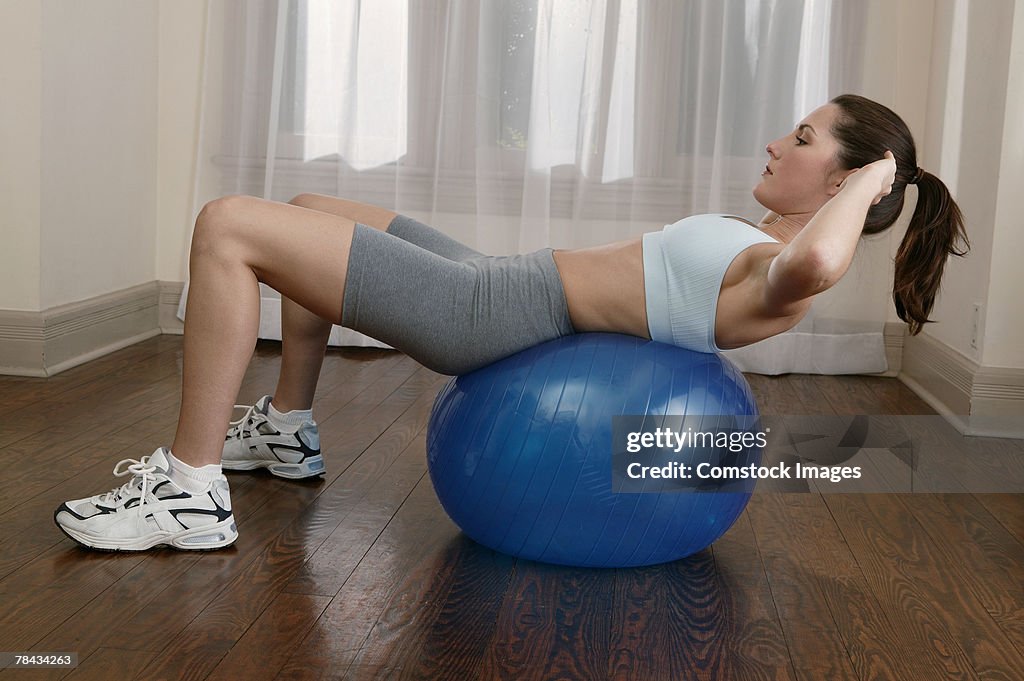 Woman exercising with fitness ball