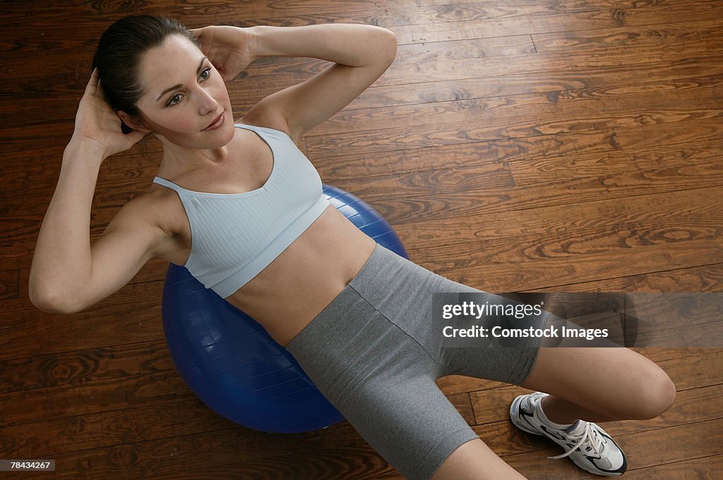 Woman exercising with fitness ball