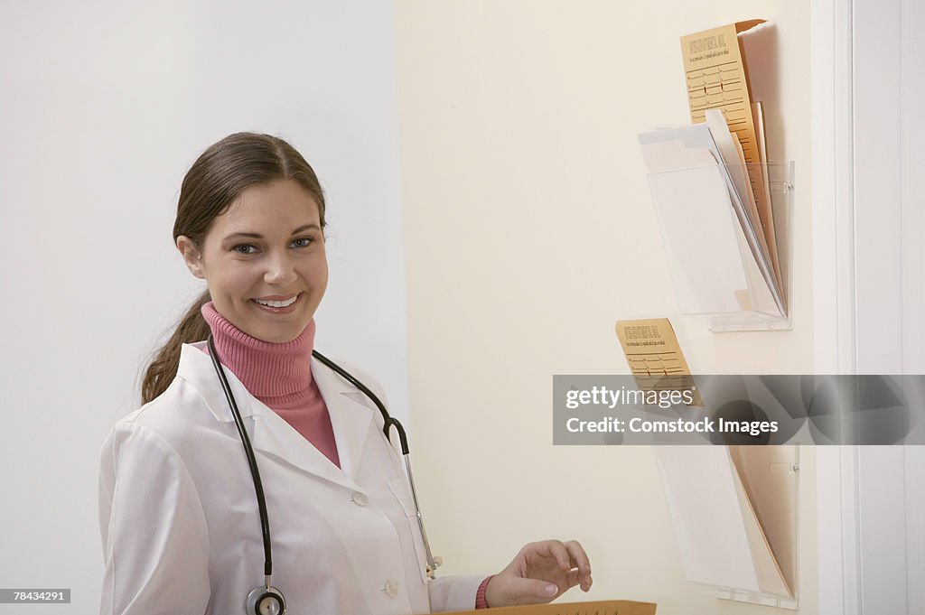 Portrait of doctor in hallway with charts