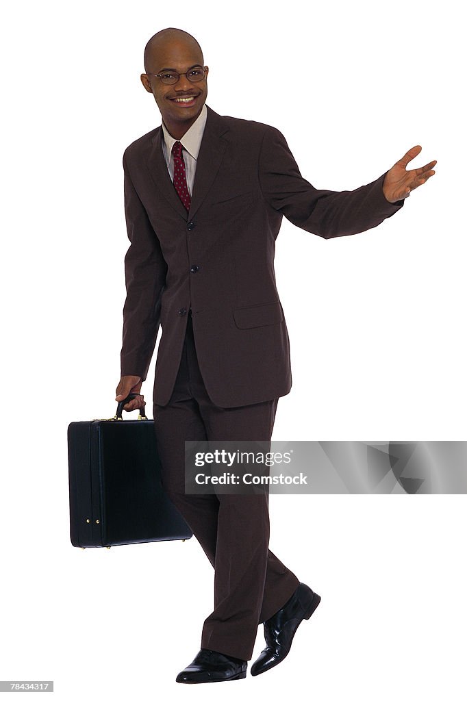 Businessman with briefcase walking