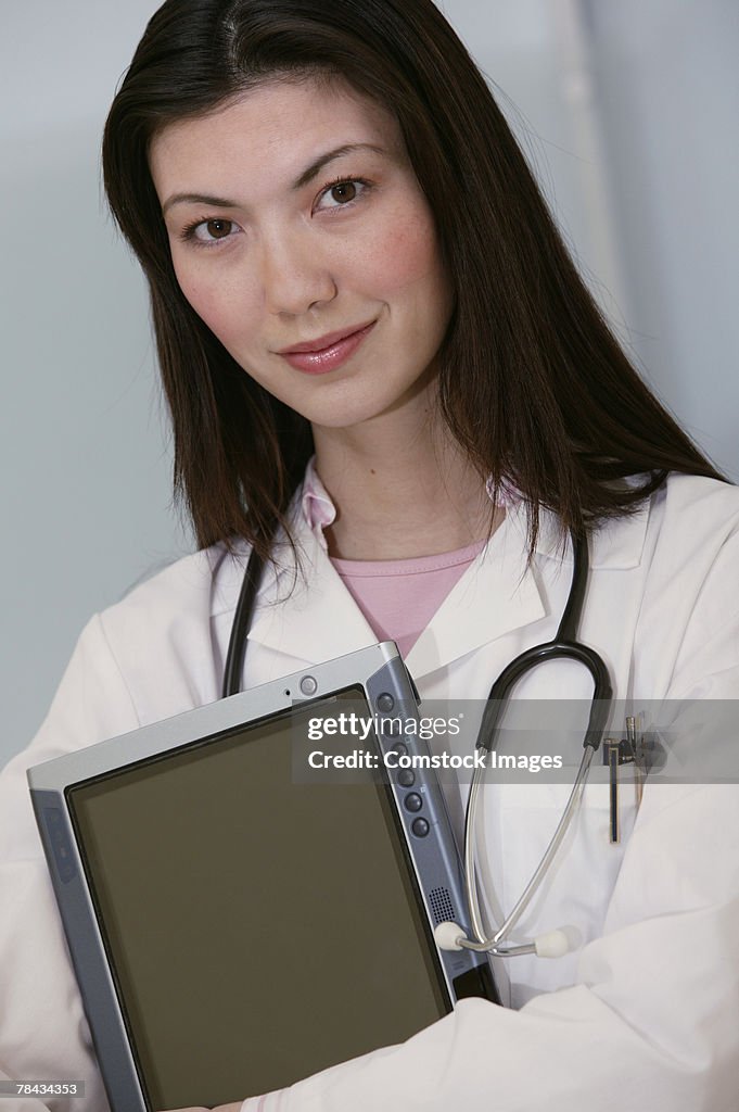 Portrait of doctor with tablet pc