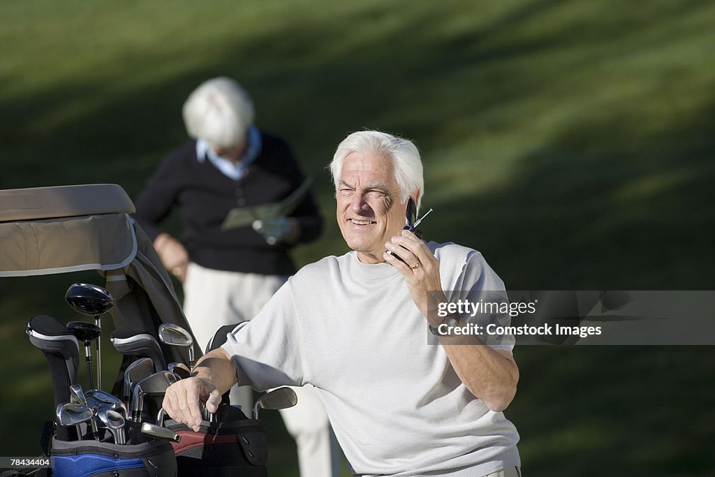 Golfer on cell phone