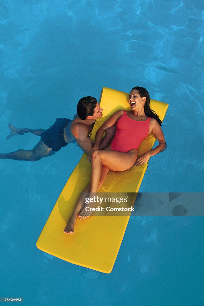 Couple in swimming pool