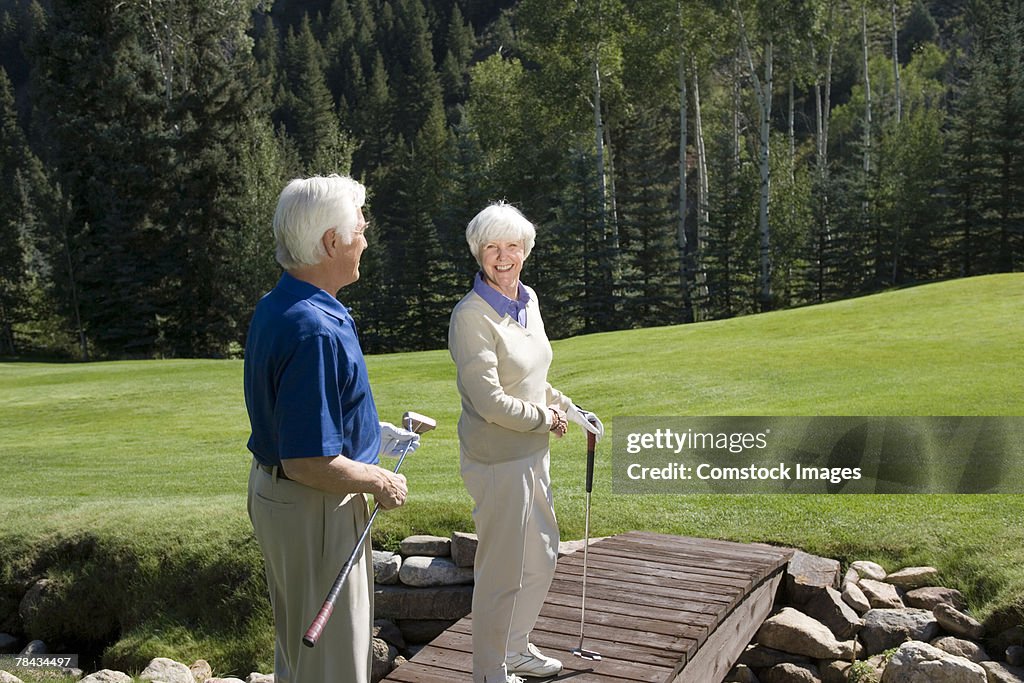 Couple on bridge on golf course