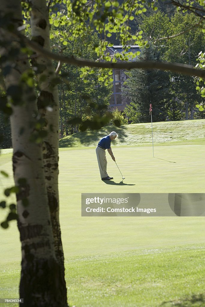 Man playing golf