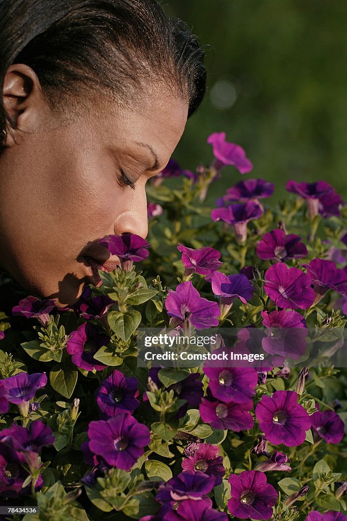 Woman smelling flowers