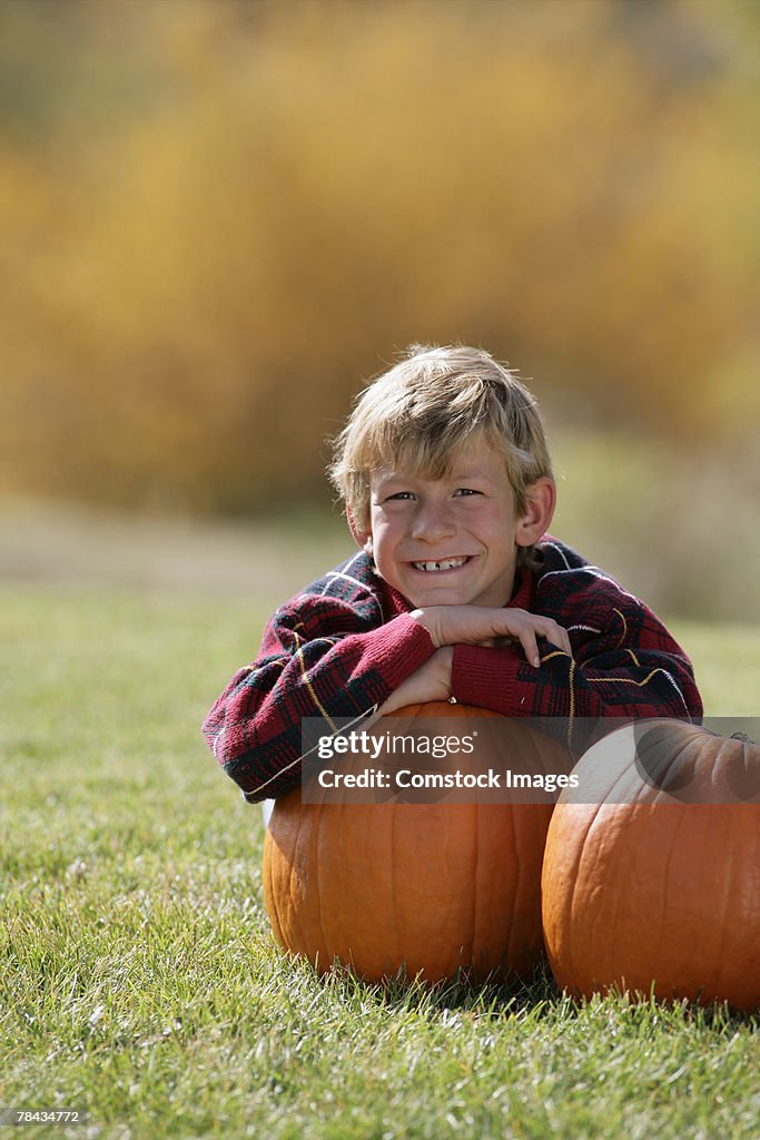 Boy holding a pumpkin