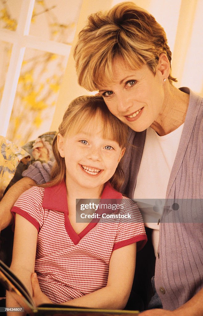 Mother and daughter sitting together