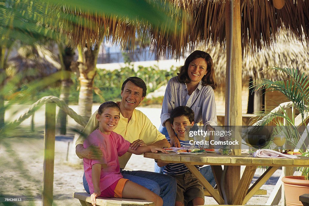 Family vacationing at tropical resort
