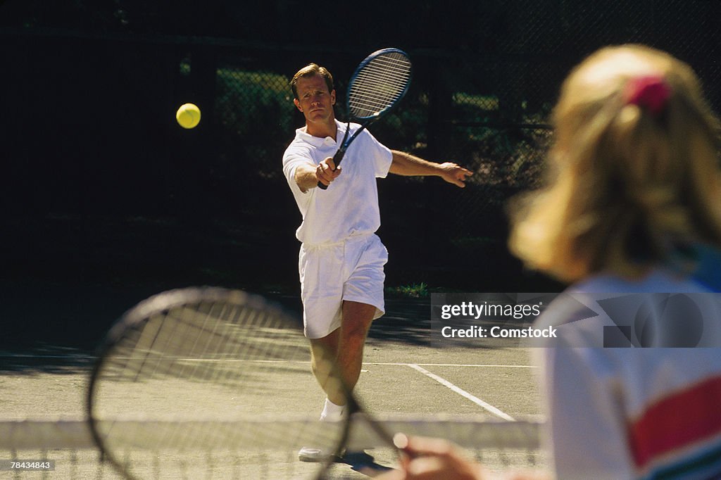 Man playing tennis match