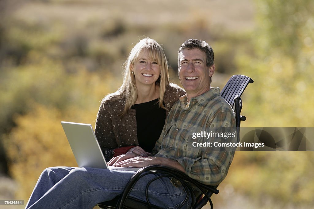 Couple using laptop