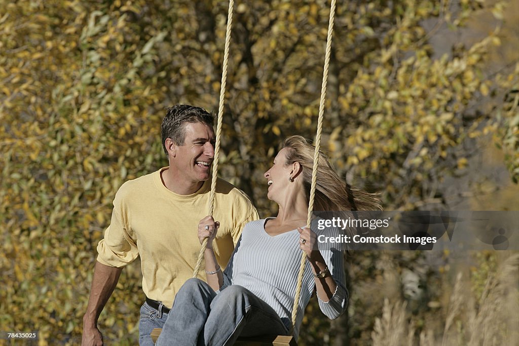 Couple swinging