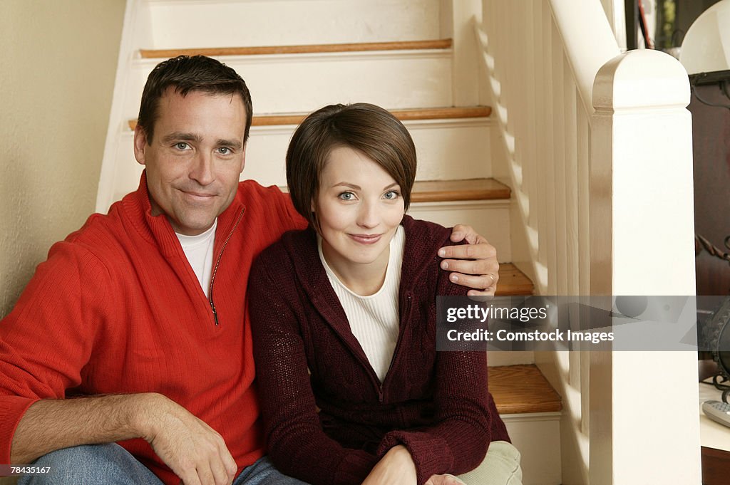 Couple sitting on staircase