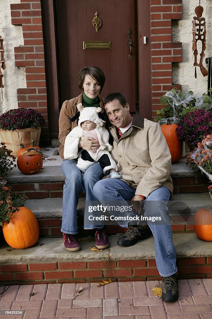 Parents with baby dressed in cow costume