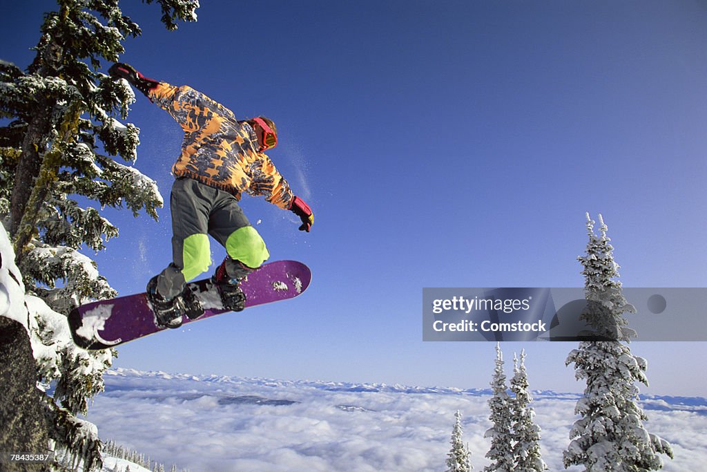 Man snowboarding in British Columbia , Canada