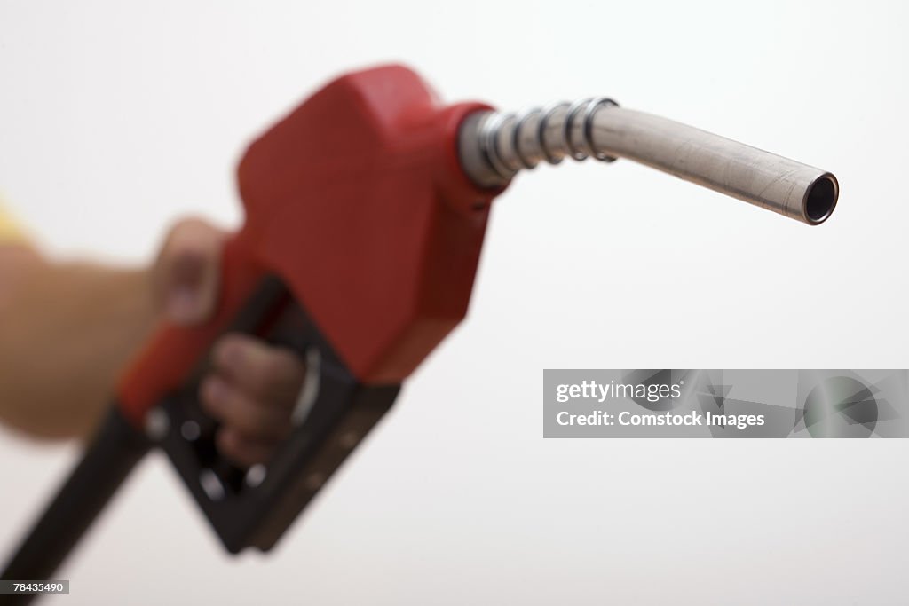 Hand holding a gas pump