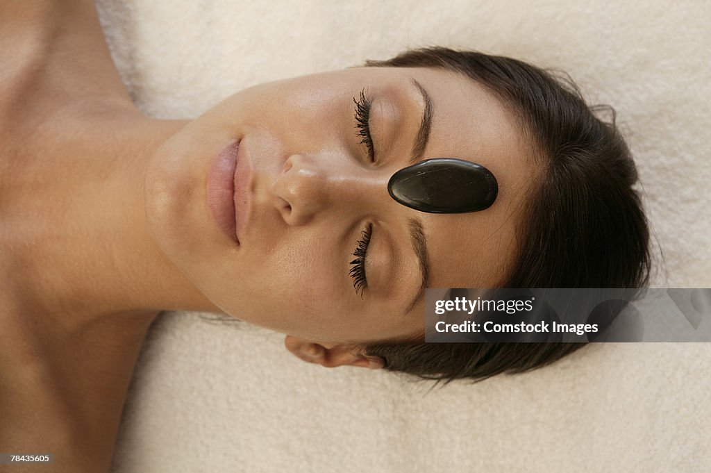 Woman getting hot stone massage