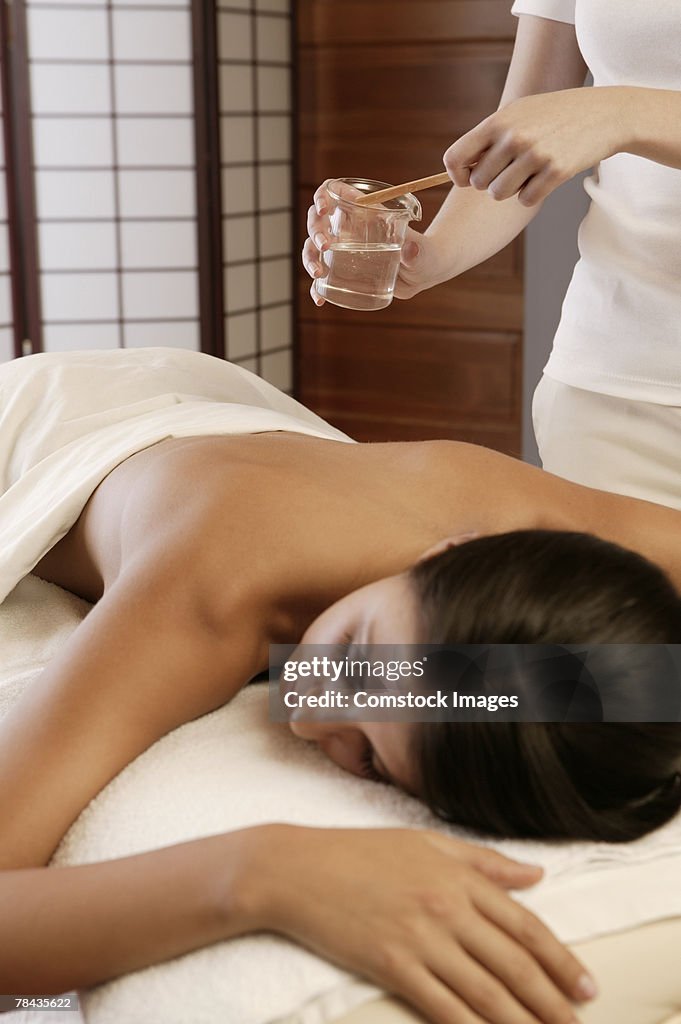 Woman getting hot oil massage