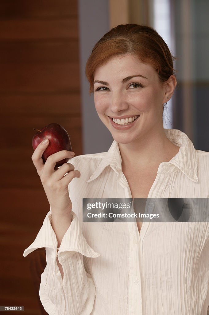 Woman eating apple