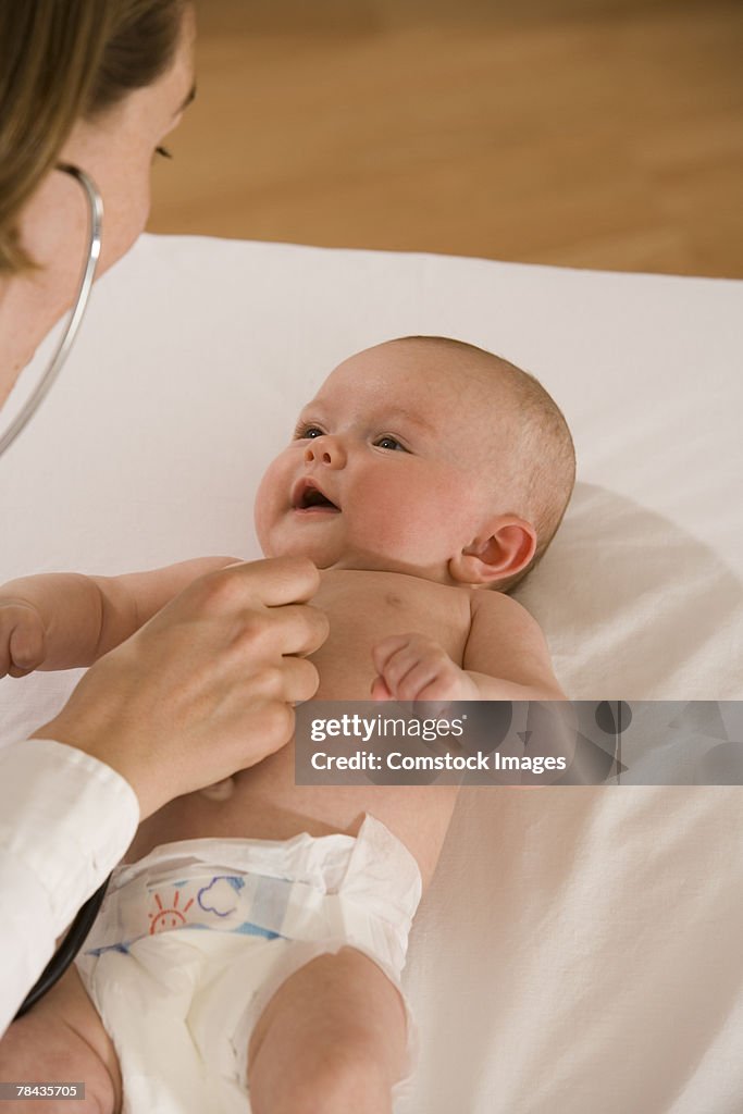 Doctor examining baby