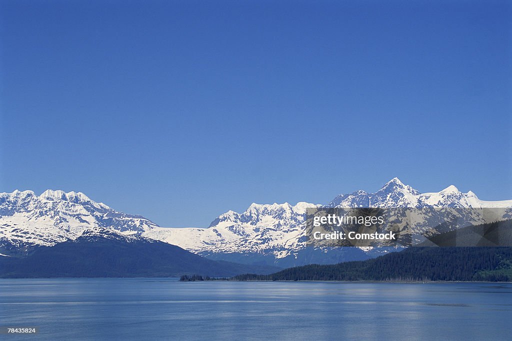 Snowy mountain range over lake