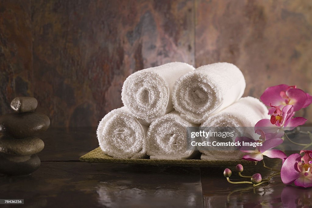 Towels, flowers, and stones