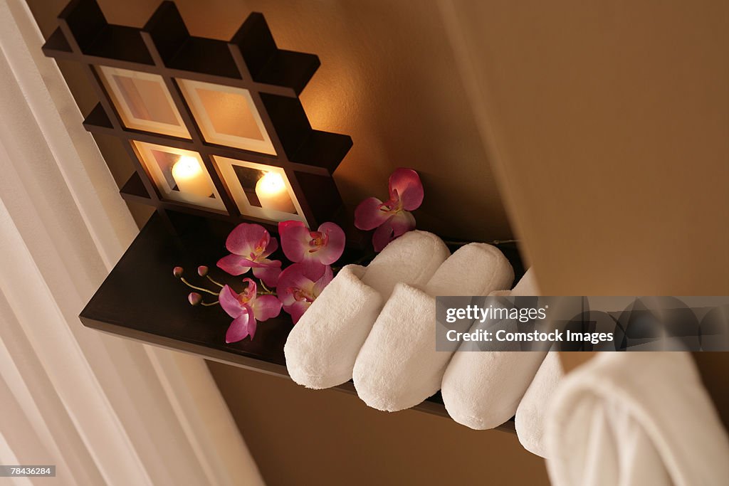 Slippers, flowers, and candles