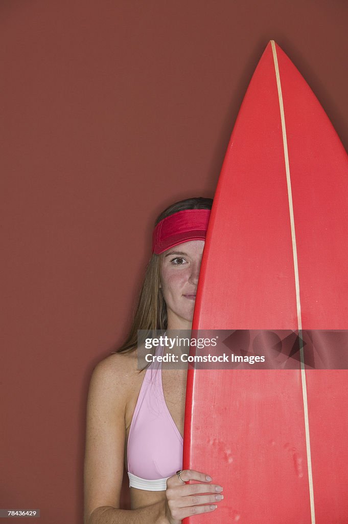 Woman holding surfboard