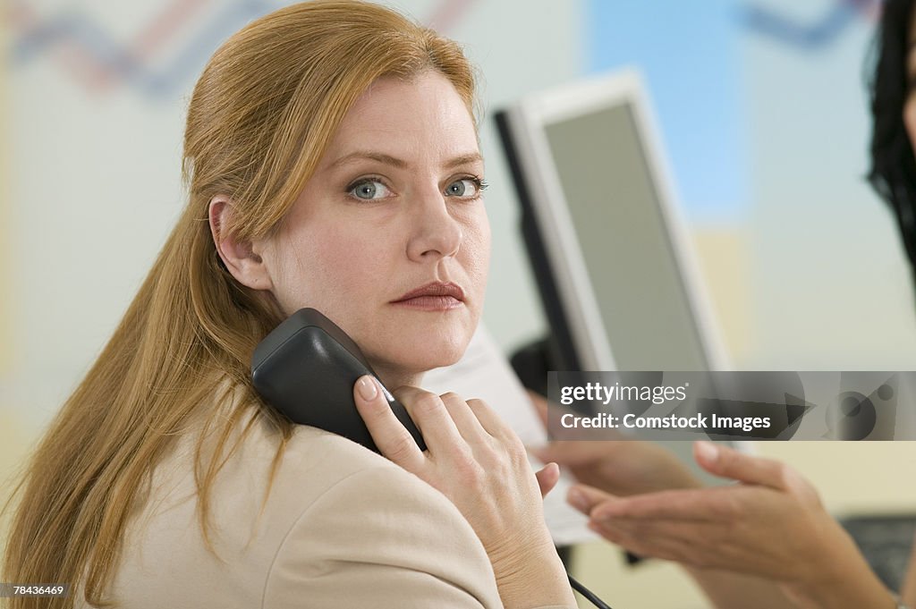 Businesswoman talking on telephone