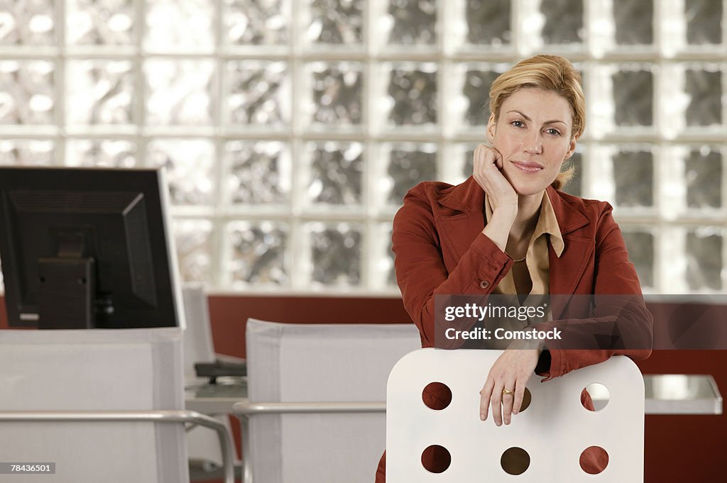 Businesswoman posing at workplace