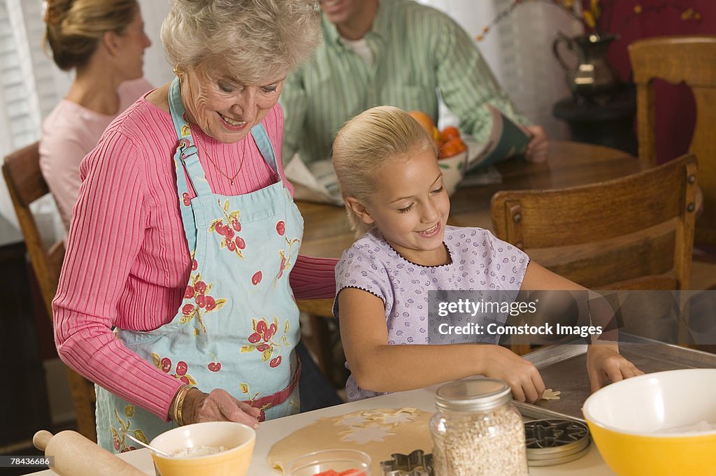 Grandmother and granddaughter baking