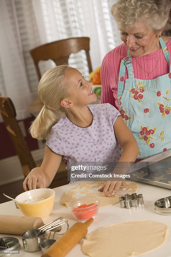 Grandmother and granddaughter baking