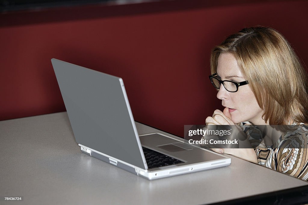 Woman using laptop computer