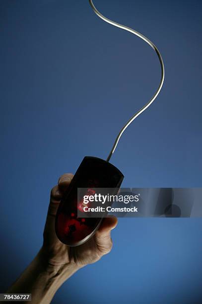 hand on computer mouse - click below stock pictures, royalty-free photos & images