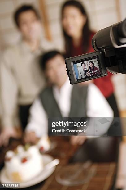 video camera filming birthday party - dvr stock pictures, royalty-free photos & images