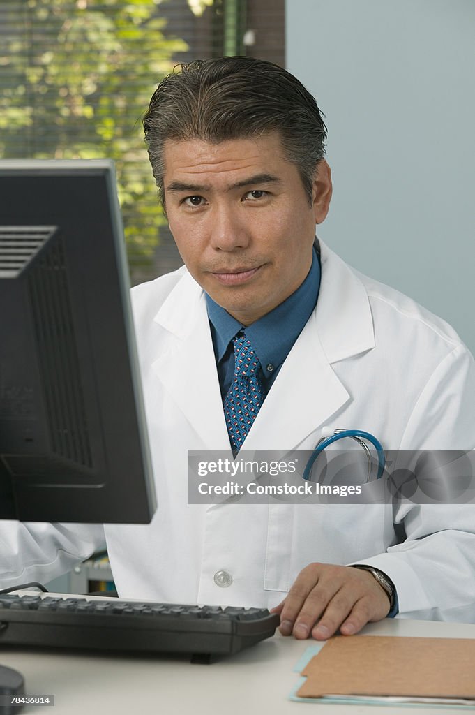 Medical professional using computer.