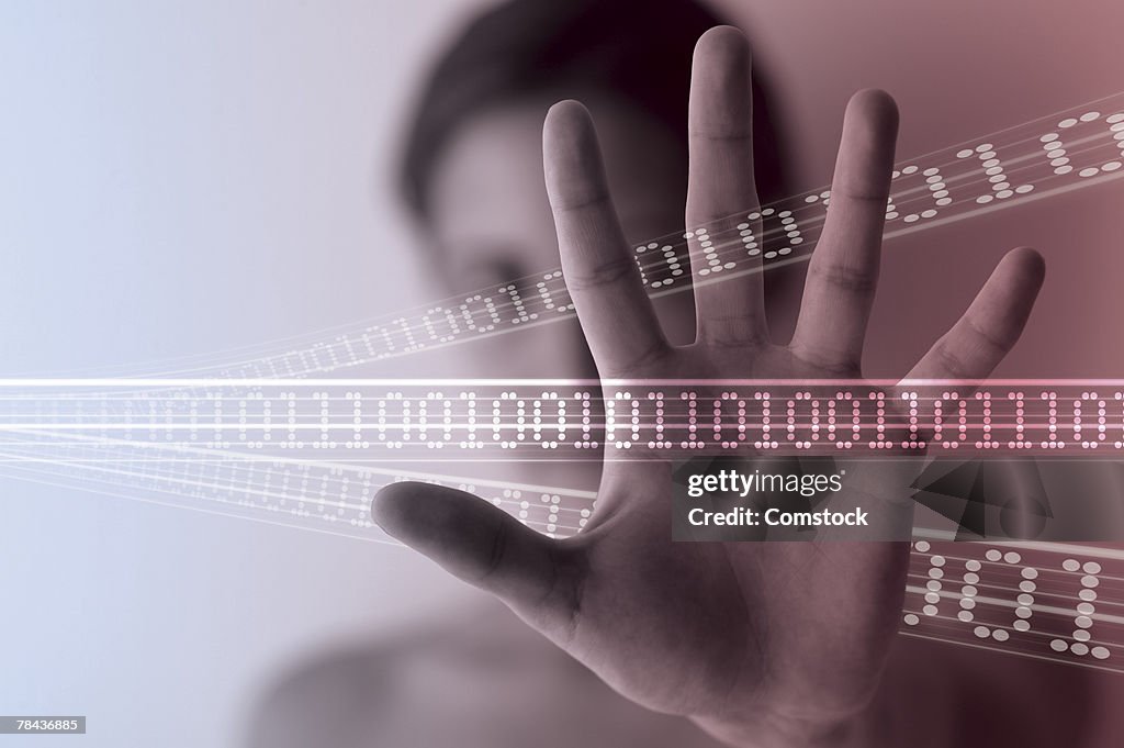 Woman's hand with binary code going through it