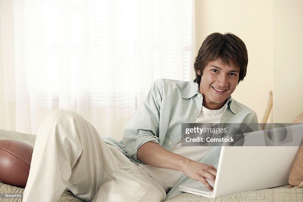 Teenage boy with laptop