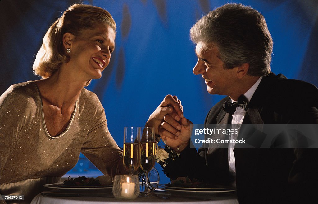 Couple sharing a romantic moment at dinner
