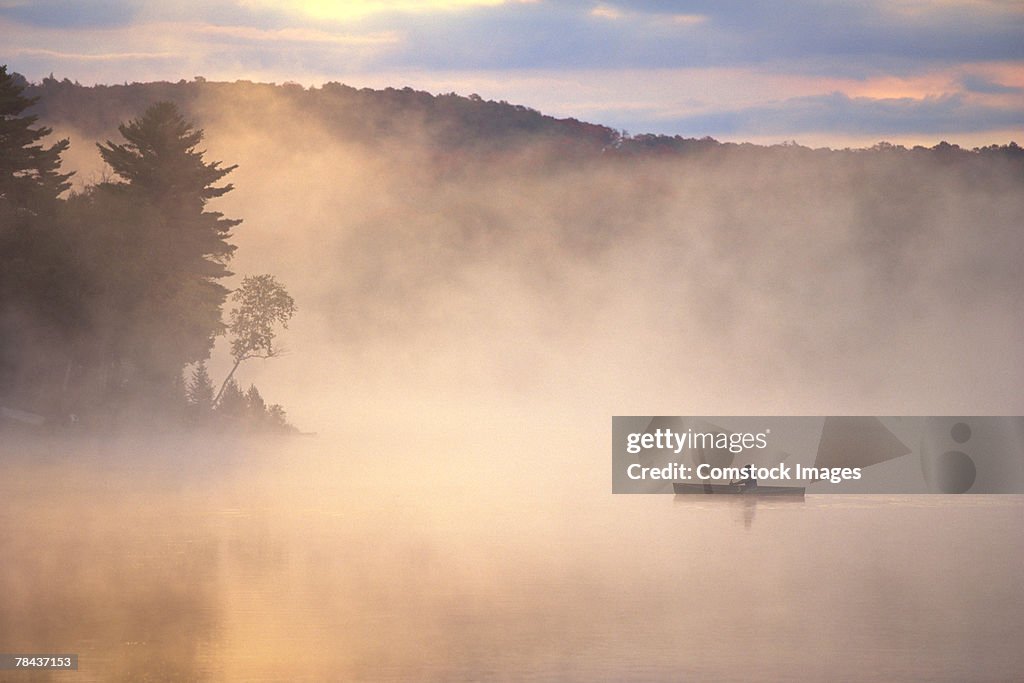 Canoe on a foggy lake