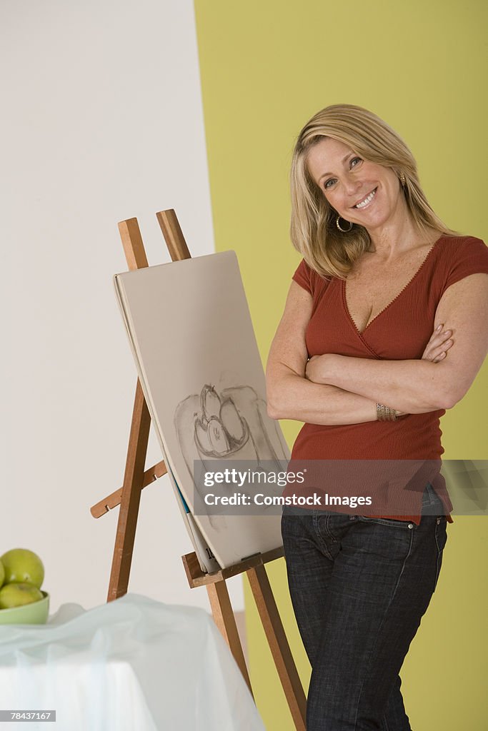 Woman posing by a sketch