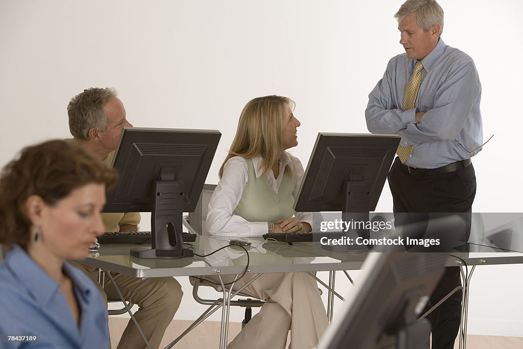 Businesspeople conversing in a meeting