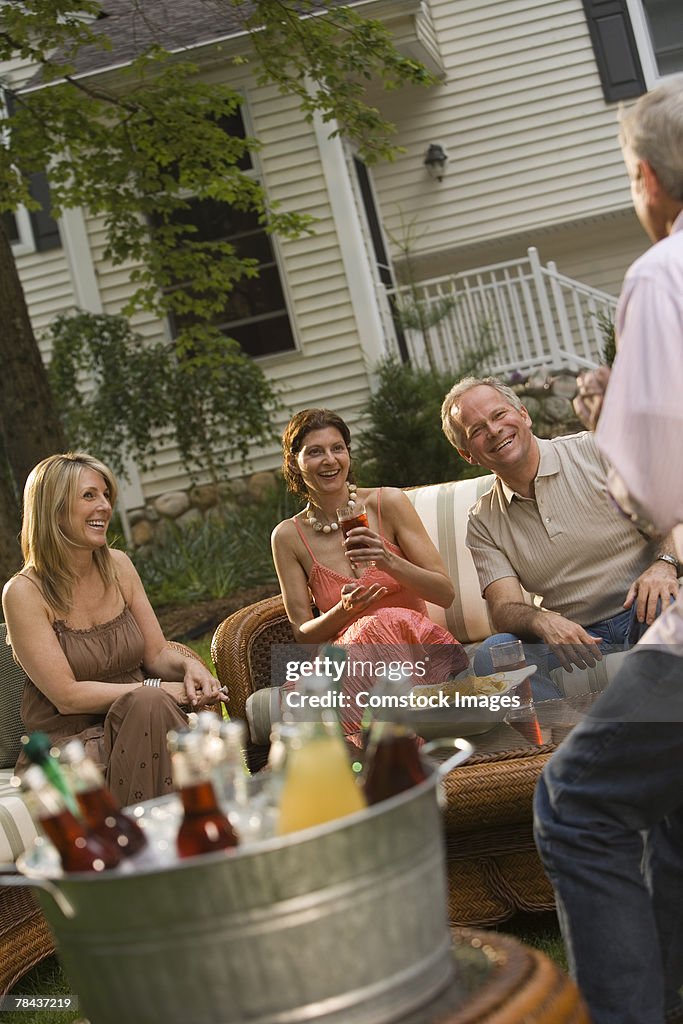 Friends conversing at a party